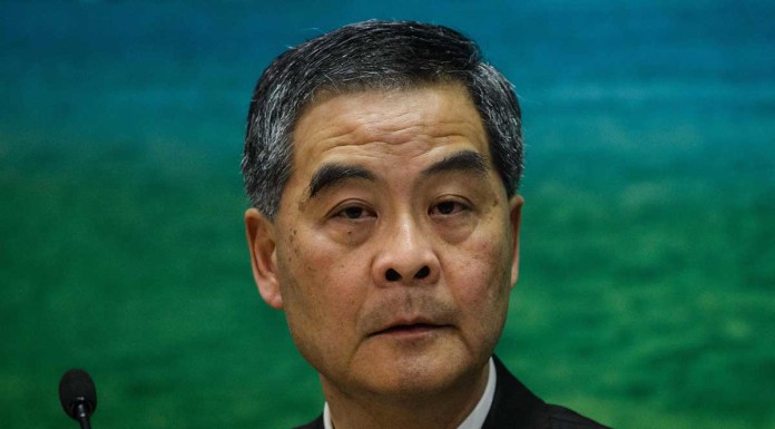 Hong Kong leader says will implement China ban on lawmakers