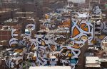 Graffiti artist creates mural spanning 50 buildings in Garbage City - 0