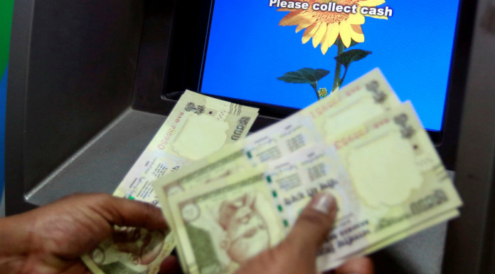 Stocks slide, ATMs run dry after India rupee shock