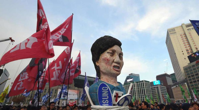 Tens of thousands of workers and students ups pressure on S Korea president Park to resign