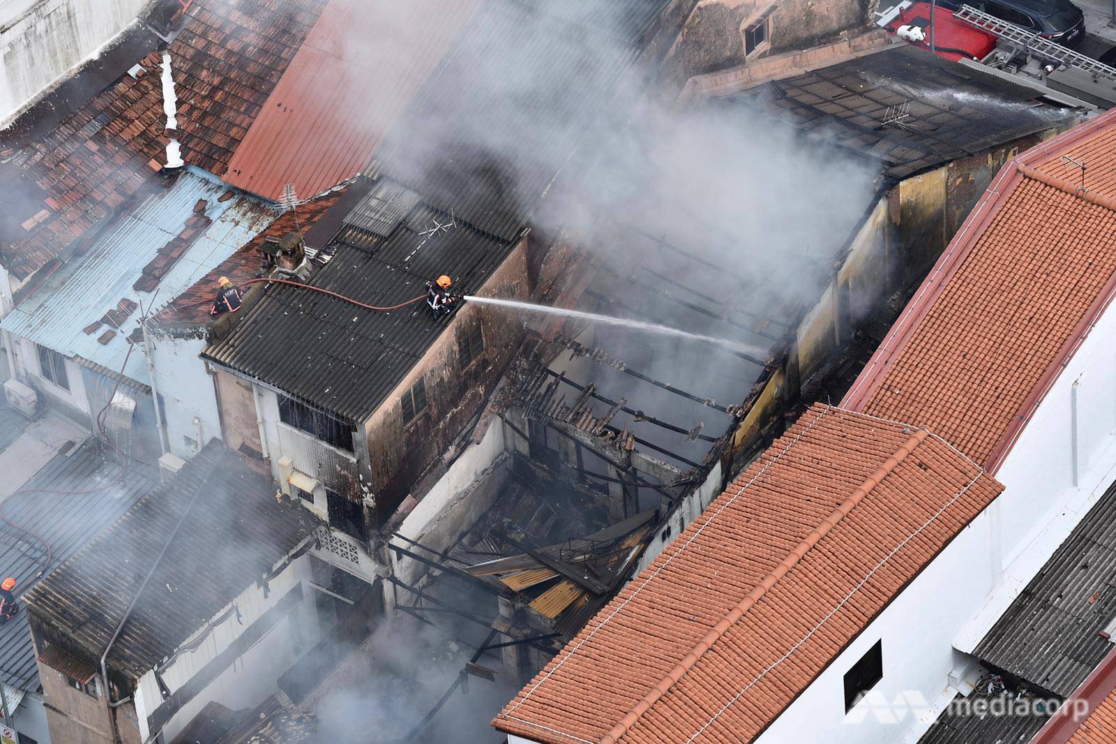 Smoke billows from a shophouse at 14 Dickson Road in Little India