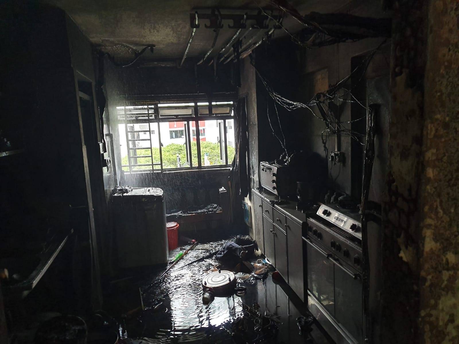 A burnt kitchen is seen after a fire erupted in Block 224 Ang Mo Kio Ave 1