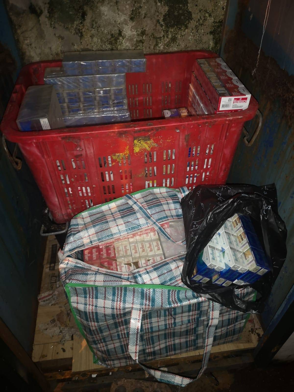 More than 1,100 packets of contraband cigarettes were seized by police in the raids