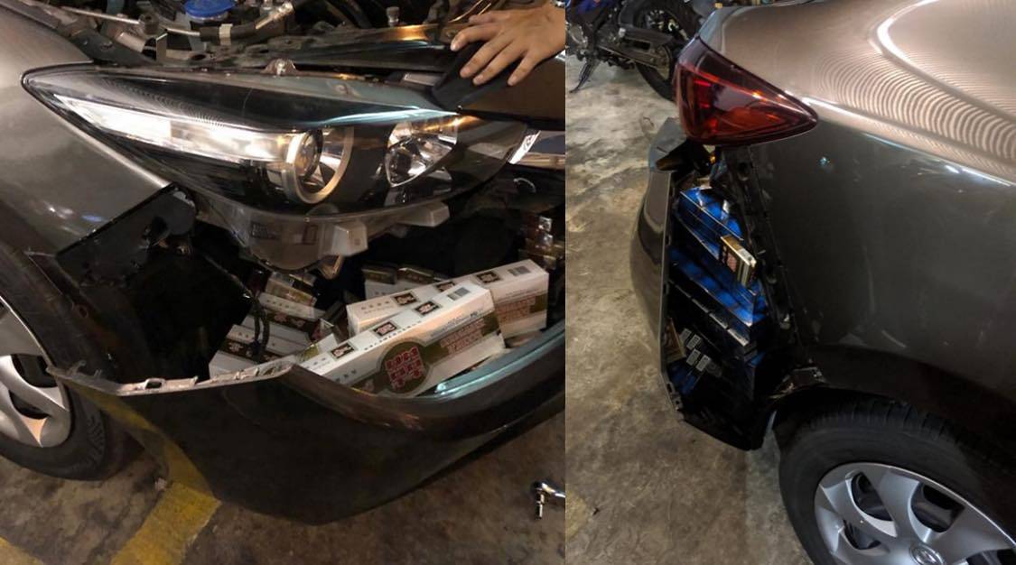 Duty-unpaid cigarettes stashed within the front and rear bumpers of a Singapore-registered car