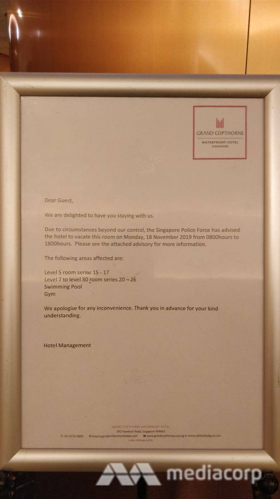 A notice at Grand Copthorne Waterfront lobby advising guests to vacate their rooms