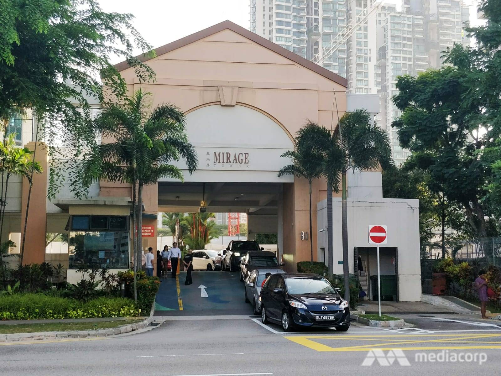 Residents exit the Mirage Tower condominium along Jiak Kim Street on Nov 18, 2019