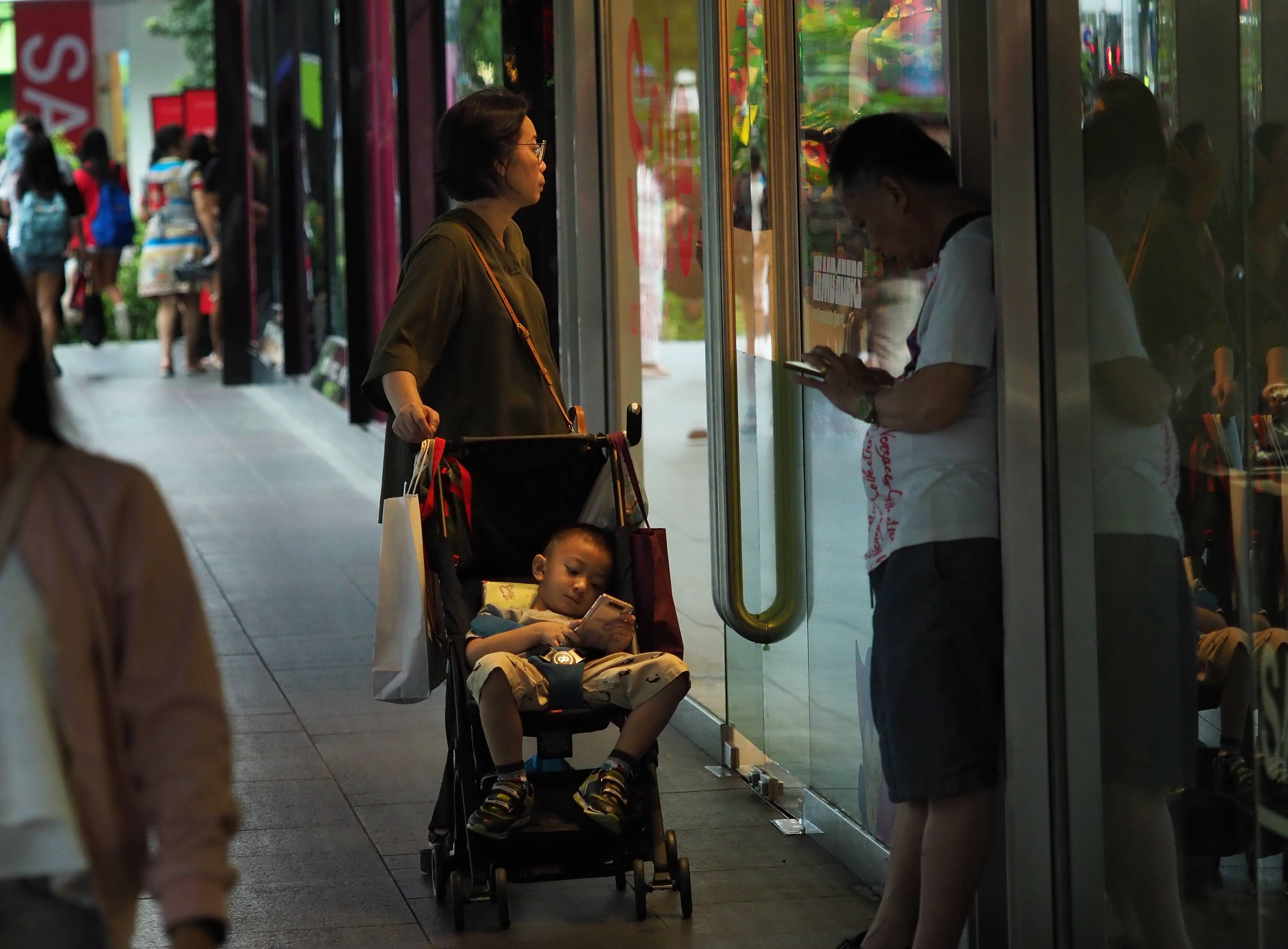 Retail sector slump shopper looks through window