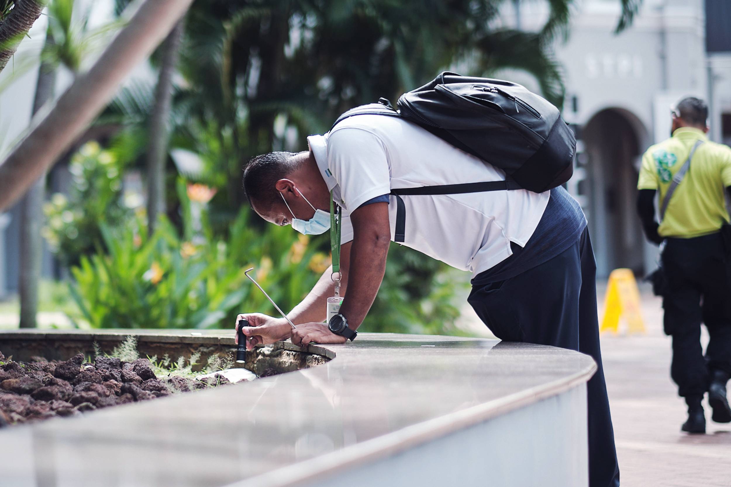 NEA dengue Officer checking for breeding in common areas